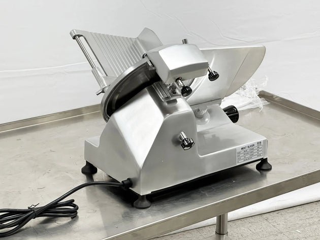 BakeMax BMMSM10 20 Inch Manual Meat Slicer Anodized Aluminum with Gravity Feed — BakeMax manufacturer photo, rear view on prep table