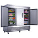 Dukers D83R three door reach-in refrigerator in a commercial kitchen