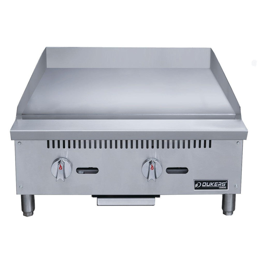 Dukers DCGMA24 gas griddle angled view showing 1 inch polished steel plate and grease trough