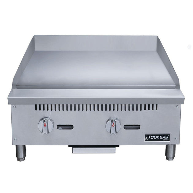 Dukers DCGMA24 gas griddle angled view showing 1 inch polished steel plate and grease trough