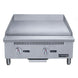 Dukers DCGMA24 gas griddle angled view showing 1 inch polished steel plate and grease trough