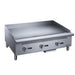 Dukers DCGMA36 36 inch manual gas griddle with three burner controls and 1 inch polished steel plate