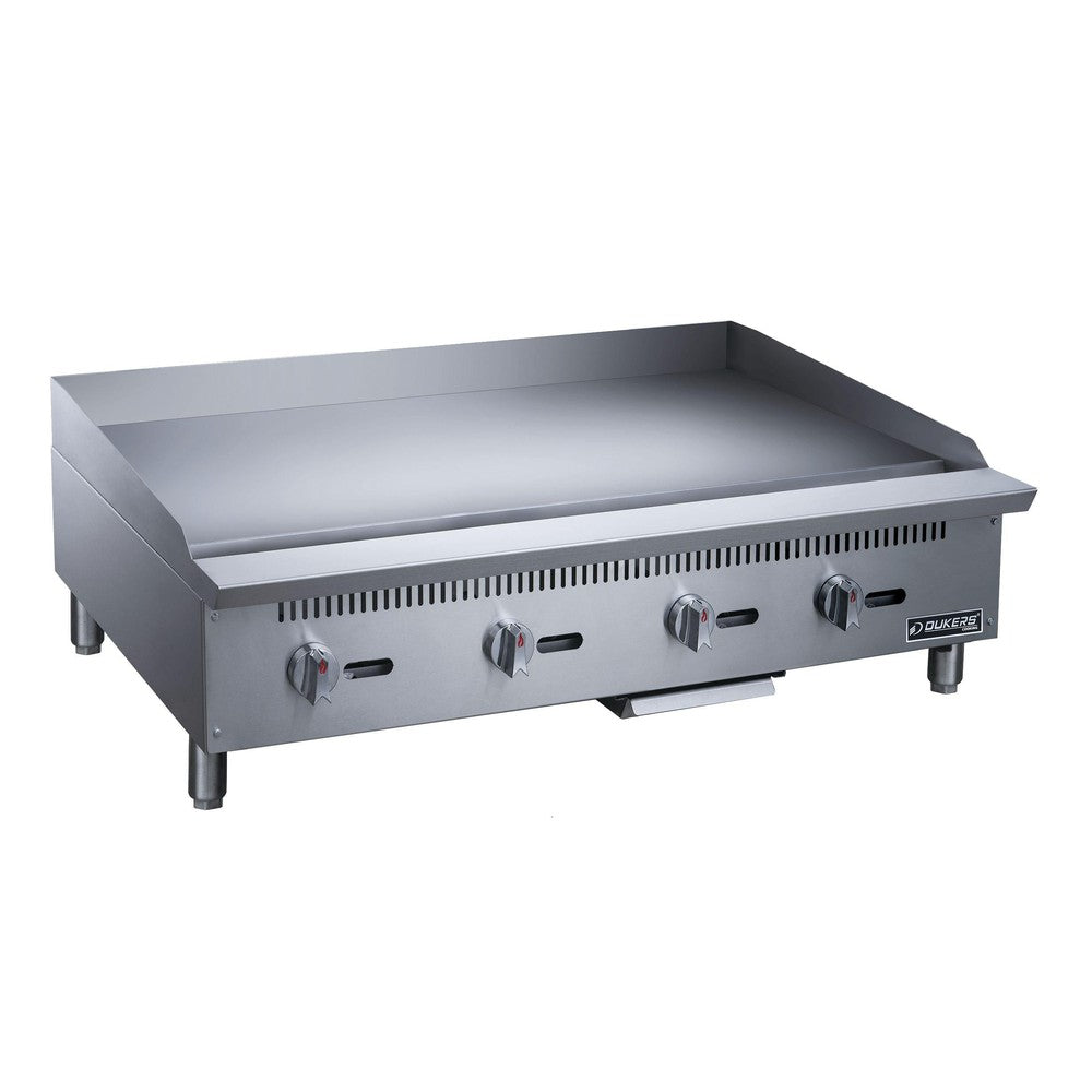 Dukers DCGMA48 48 inch manual gas griddle with four burner controls and 1 inch polished steel plate