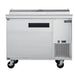 Dukers DPP44 pizza prep table with the topping rail cover raised showing six one-third size pans