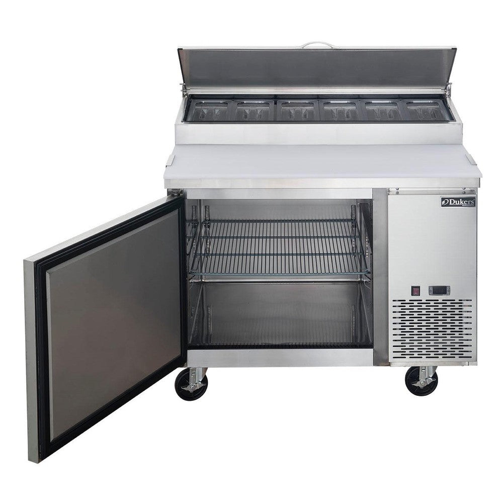 Dukers DPP44 pizza prep table with the door open showing the interior shelf and cabinet