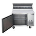 Dukers DPP44 pizza prep table with the door open showing the interior shelf and cabinet