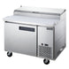 Side view of the Dukers DPP44 pizza prep table showing the cutting board depth and caster mounting