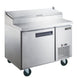 Dukers DPP44 44 inch stainless steel pizza prep table with single solid door and hinged topping rail cover