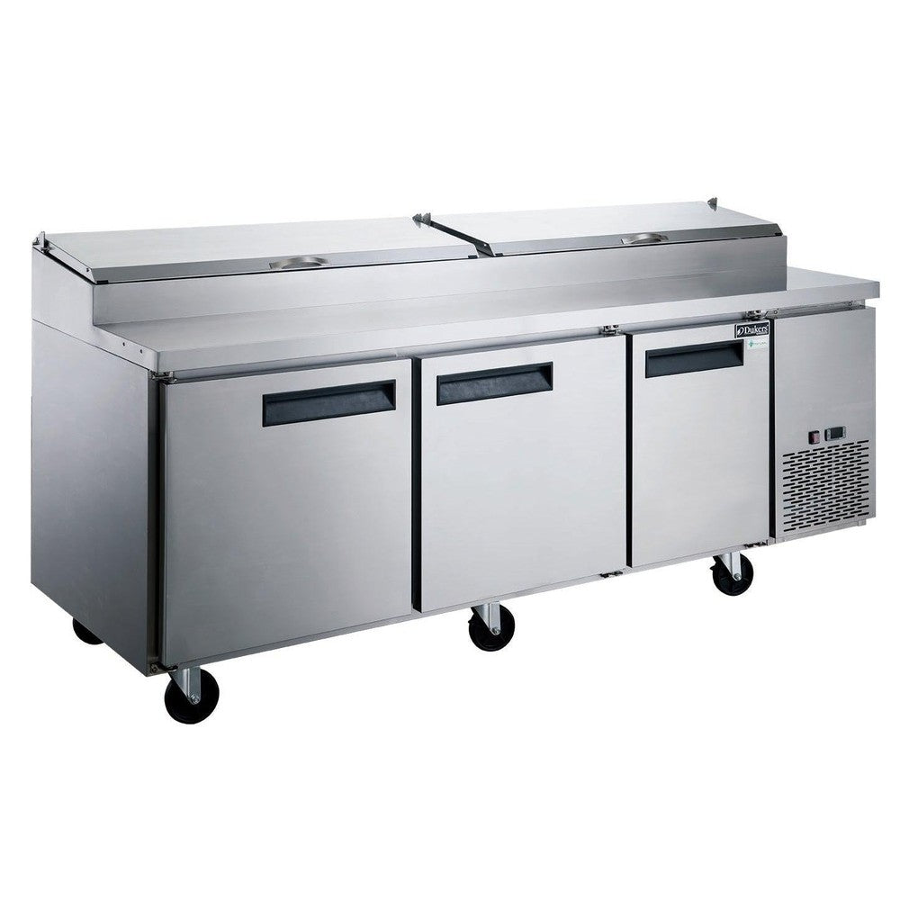 Dukers DPP90 90 inch stainless steel three door pizza prep table with hinged topping rail cover