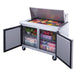 Dukers DSP48-18M-S2 two section refrigerated base cabinet interior